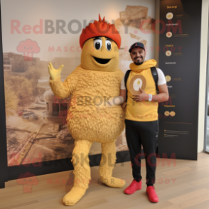 Gold Paella mascot costume character dressed with a Joggers and Keychains