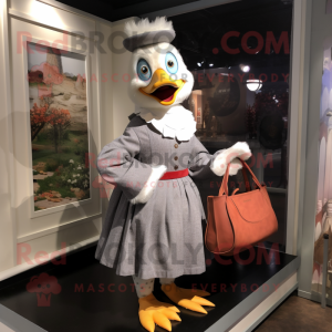 Gray Muscovy Duck mascot costume character dressed with a A-Line Skirt and Tote bags