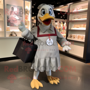 Gray Muscovy Duck mascot costume character dressed with a A-Line Skirt and Tote bags