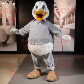 Silver Geese mascot costume character dressed with a Dress Shirt and Shoe clips