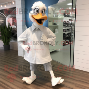 Silver Geese mascot costume character dressed with a Dress Shirt and Shoe clips