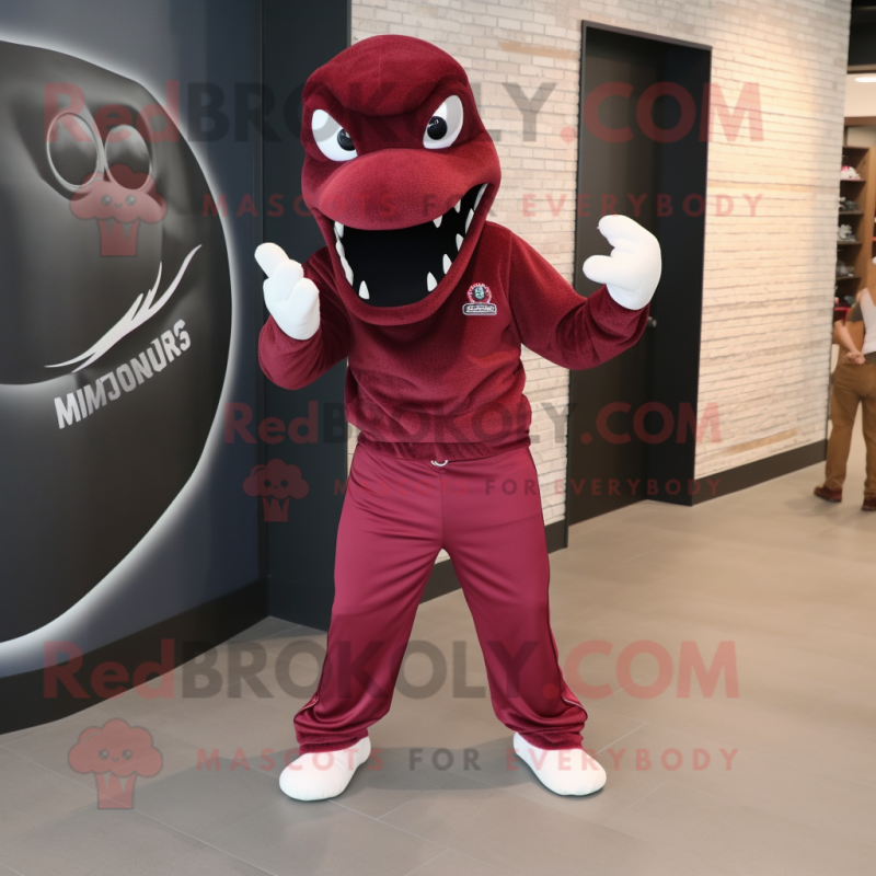 Maroon Hydra mascot costume character dressed with a Joggers and Hats