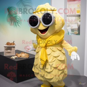 Yellow Cod mascot costume character dressed with a Wrap Dress and Sunglasses