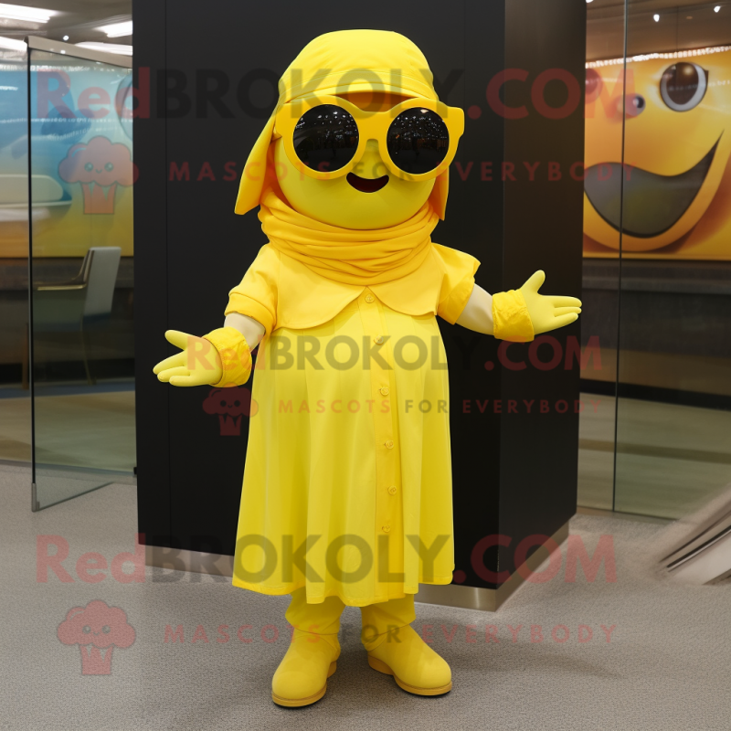 Yellow Cod mascot costume character dressed with a Wrap Dress and Sunglasses Yellow Cod mascot costume character dressed with a Wrap Dress and Sunglasses