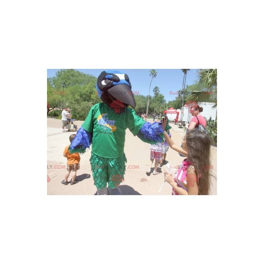 Mascotte d'oiseau vert bleu blanc et noir de corbeau -