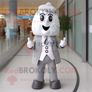 Silver Ice Cream mascot costume character dressed with a Coat and Tie pins