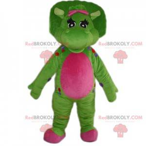 Muy bonita mascota dinosaurio verde y fucsia. - Redbrokoly.com