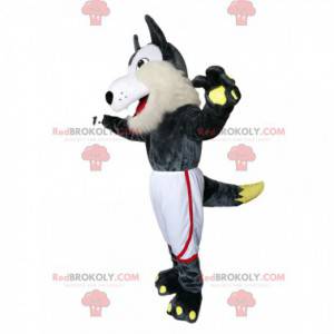 Mascotte de loup gris et blanc avec un short de sport blanc -
