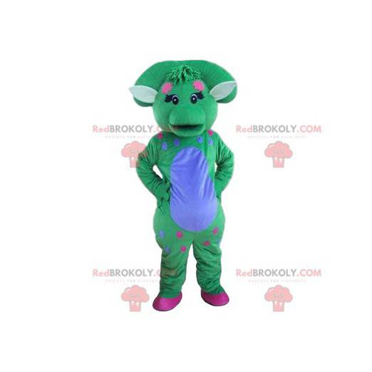 Mascota dinosaurio azul y verde pastel con una bocanada -