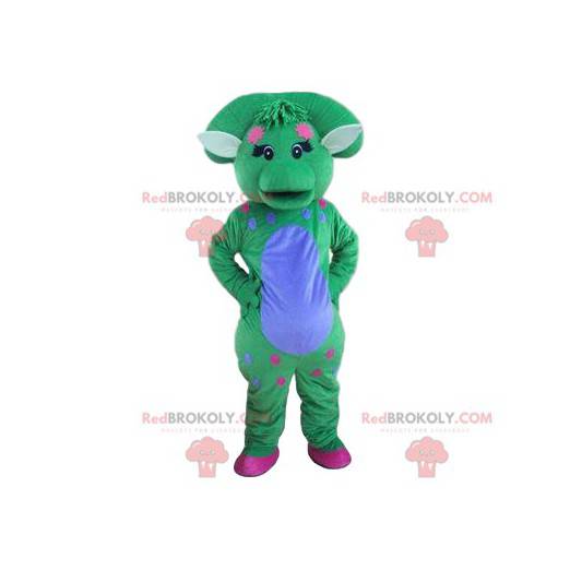 Mascotte di dinosauro blu e verde pastello con un soffio -