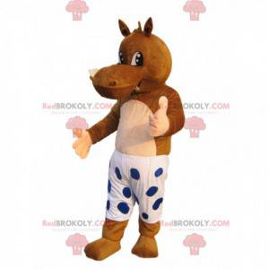 Mascote hipopótamo marrom com shorts brancos e bolinhas azuis -