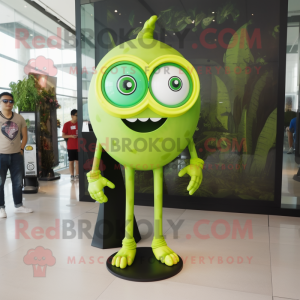 Lime Green Cyclops mascot costume character dressed with a Graphic Tee and Eyeglasses