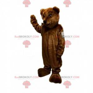 Mascotte d'ours brun avec un beau museau et un joli sourire -