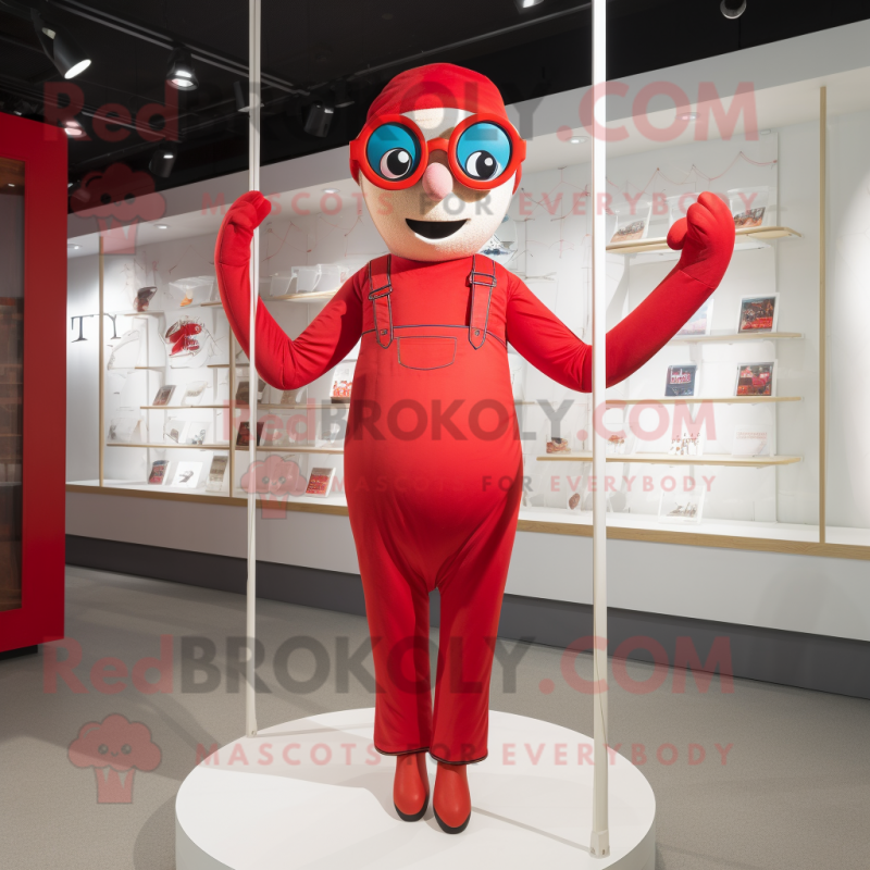 Red Trapeze Artist mascot costume character dressed with a Playsuit and Reading glasses