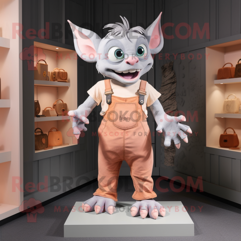 Peach Gargoyle mascot costume character dressed with a Dungarees and Wallets