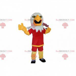 Mascote águia dourada com roupa esportiva vermelha -