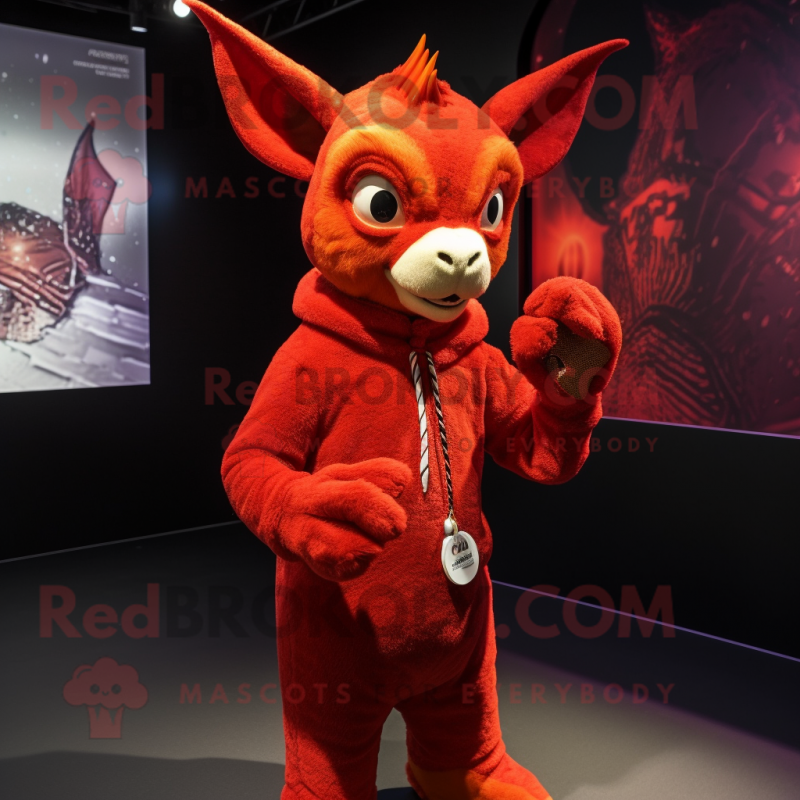 Red Chupacabra mascot costume character dressed with a Coat and Bracelets