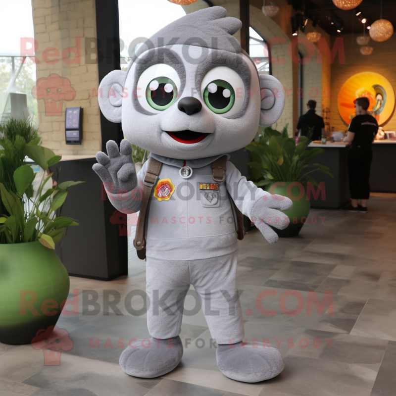 Gray Shakshuka mascot costume character dressed with a Jumpsuit and Keychains Gray Shakshuka mascot costume character dressed with a Jumpsuit and Keychains