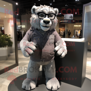 Gray Smilodon mascot costume character dressed with a Polo Tee and Eyeglasses
