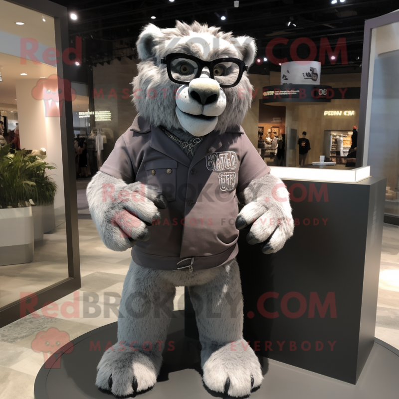 Gray Smilodon mascot costume character dressed with a Polo Tee and Eyeglasses Gray Smilodon mascot costume character dressed with a Polo Tee and Eyeglasses