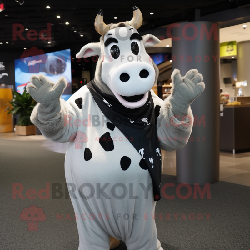 Silver Holstein Cow mascot costume character dressed with a Graphic Tee and Wraps Silver Holstein Cow mascot costume character dressed with a Graphic Tee and Wraps