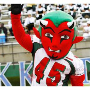 Red and green devil mascot in sportswear