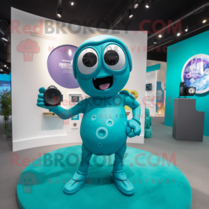 Turquoise Camera mascot costume character dressed with a Swimwear and Rings