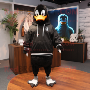 Black Goose mascot costume character dressed with a Sweatshirt and Keychains