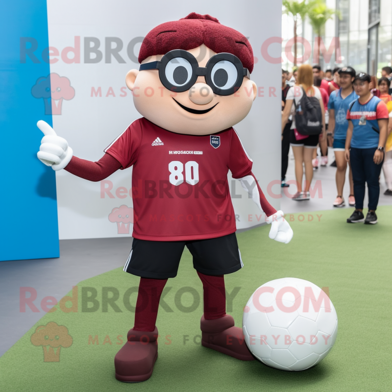Maroon Soccer Ball mascot costume character dressed with a Flare Jeans and Eyeglasses Maroon Soccer Ball mascot costume character dressed with a Flare Jeans and Eyeglasses