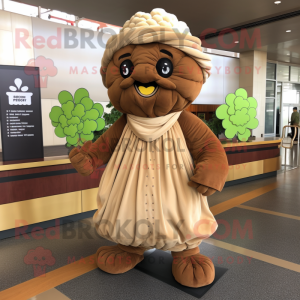 Brown Cauliflower mascot costume character dressed with a Empire Waist Dress and Scarves