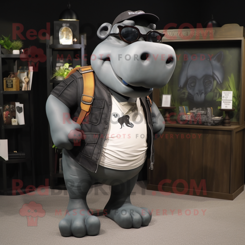 Black Hippopotamus mascot costume character dressed with a Cargo Shorts and Eyeglasses