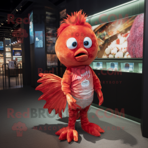 Red Betta Fish mascot costume character dressed with a Graphic Tee and Earrings