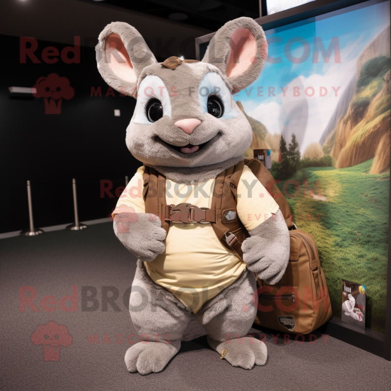 Tan Chinchilla mascot costume character dressed with a Sweater and Messenger bags Tan Chinchilla mascot costume character dressed with a Sweater and Messenger bags