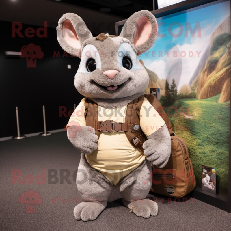 Tan Chinchilla mascot costume character dressed with a Sweater and Messenger bags