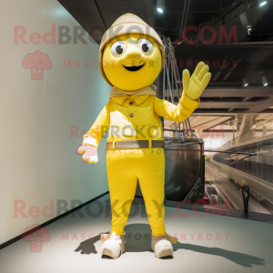 Lemon Yellow Trapeze Artist mascot costume character dressed with a Cargo Pants and Gloves