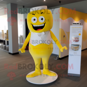 Yellow Wedding Cake mascot costume character dressed with a Yoga Pants and Suspenders