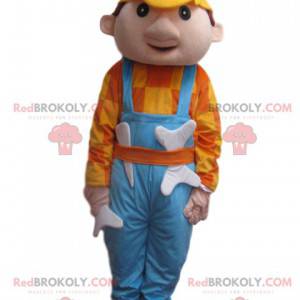 Homem mascote com macacão azul e capacete amarelo -