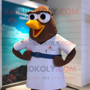 Brown Gull mascot costume character dressed with a Board Shorts and Smartwatches