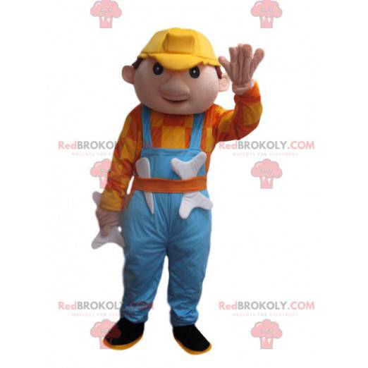 Homem mascote com macacão azul e capacete amarelo -