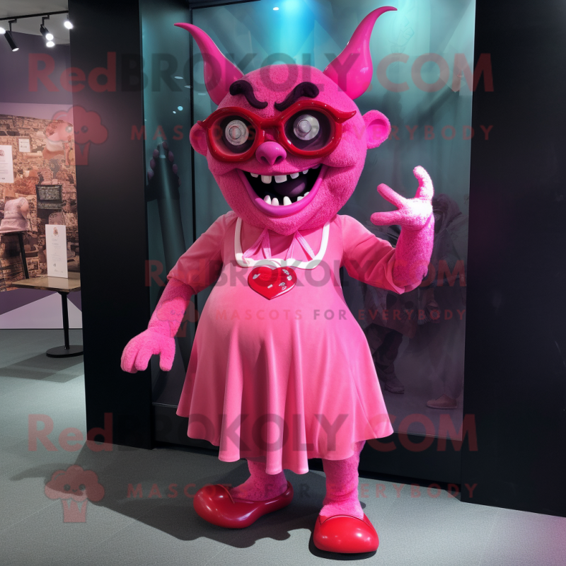 Pink Devil mascot costume character dressed with a A-Line Dress and Eyeglasses