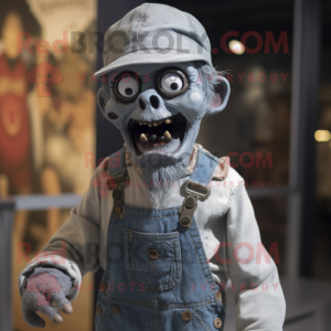 Silver Zombie mascot costume character dressed with a Dungarees and Hat pins