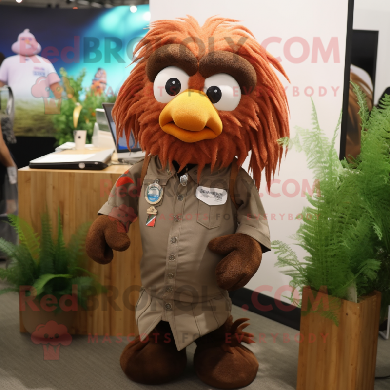 Brown Betta Fish mascot costume character dressed with a Dress Shirt and Keychains Brown Betta Fish mascot costume character dressed with a Dress Shirt and Keychains