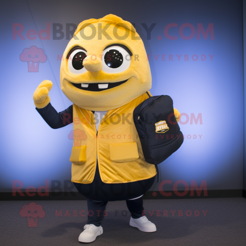 Gold Scented Candle mascot costume character dressed with a Suit Jacket and Backpacks Gold Scented Candle mascot costume character dressed with a Suit Jacket and Backpacks