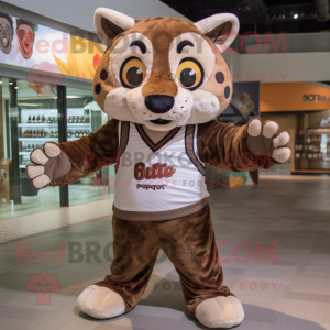 Brown Bobcat mascot costume character dressed with a Rash Guard and Shawls