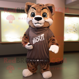 Brown Bobcat mascot costume character dressed with a Rash Guard and Shawls