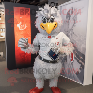 Silver Roosters mascot costume character dressed with a T-Shirt and Smartwatches