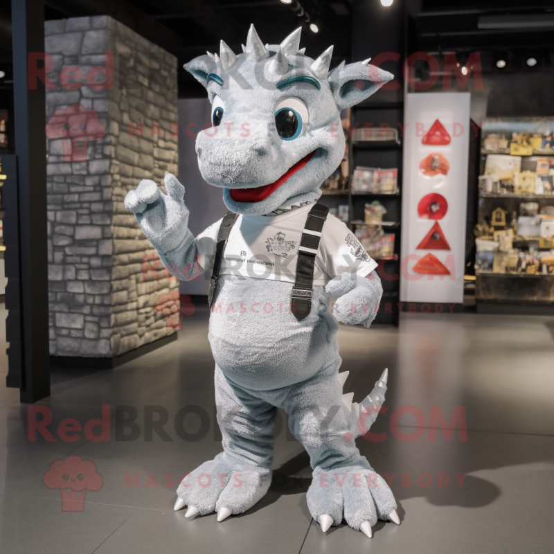 Silver Dragon mascot costume character dressed with a Dungarees and Wallets Silver Dragon mascot costume character dressed with a Dungarees and Wallets