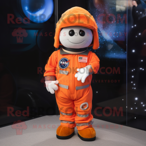 Orange Astronaut mascot costume character dressed with a Flannel Shirt and Berets