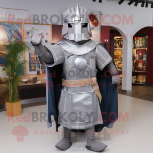 Silver Medieval Knight mascot costume character dressed with a Flannel Shirt and Shawl pins