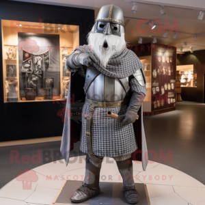 Silver Medieval Knight mascot costume character dressed with a Flannel Shirt and Shawl pins